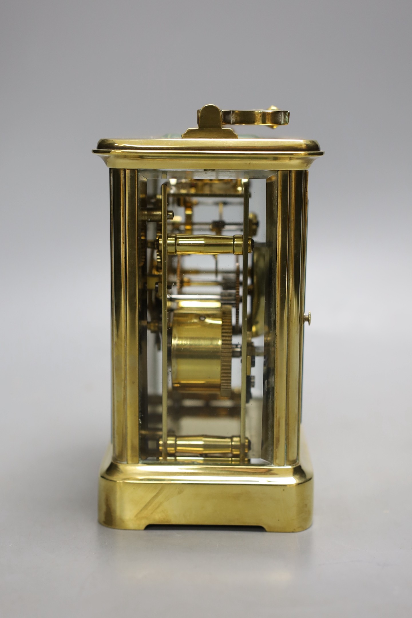 A large brass carriage clock, retail by Charles Frodsham, 14.5 cms high.